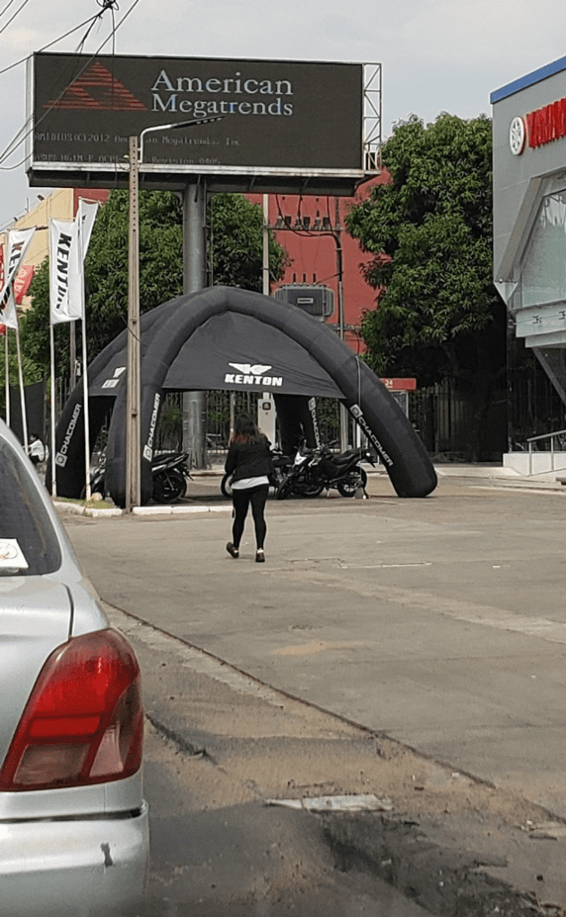 a person walking under a sign