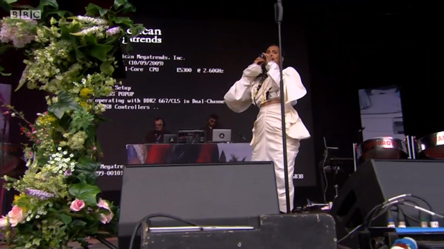 a person on a stage with a microphone