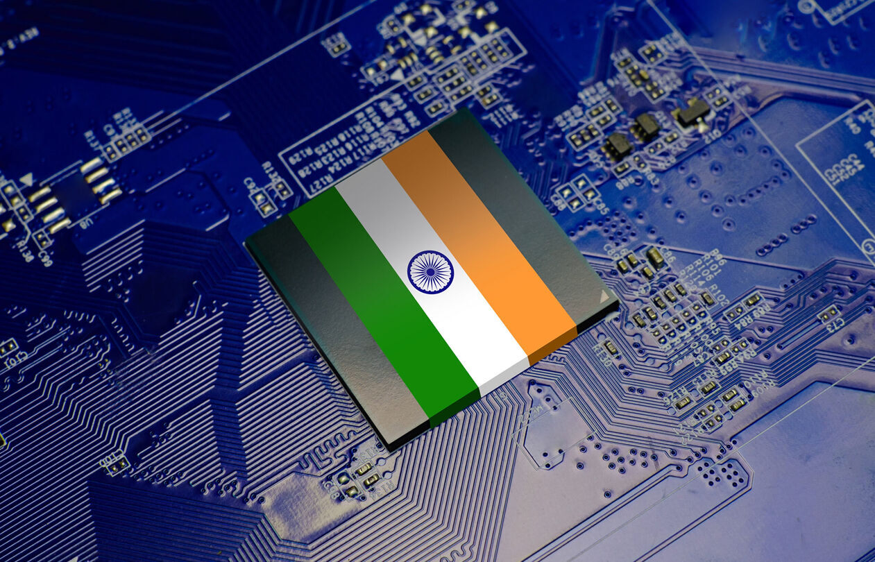A digital circuit board with a stylized representation of the Indian flag in the center.